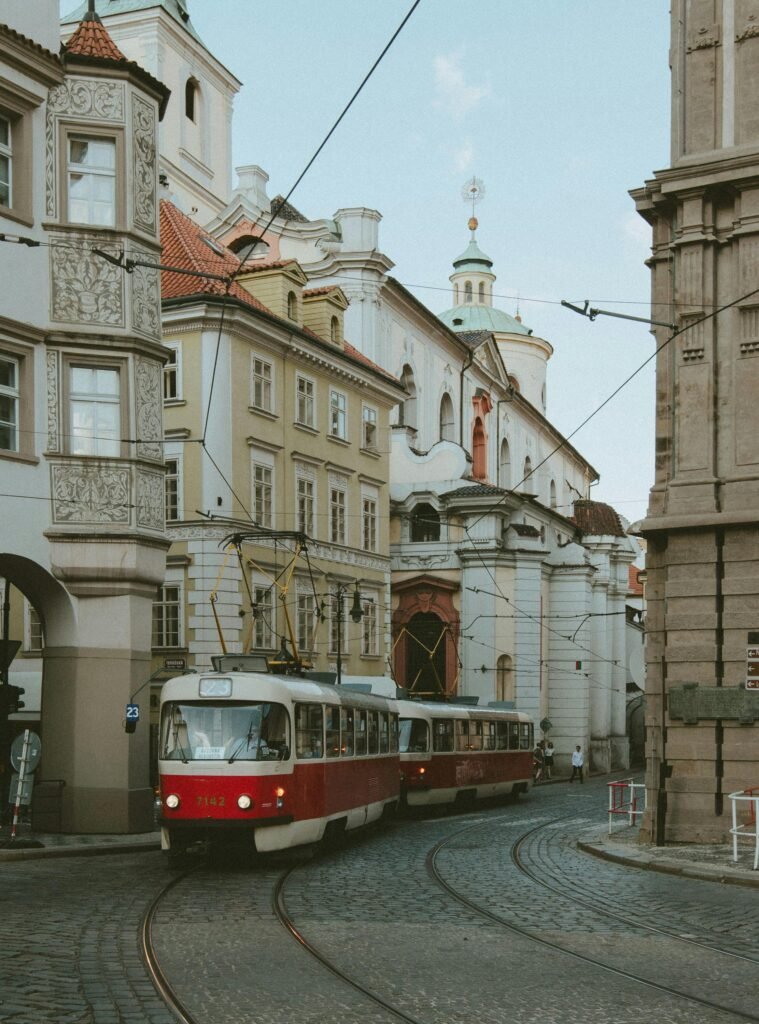 Vintage trams navigating through the historic streets of Prague, a city rich in architectural heritage.